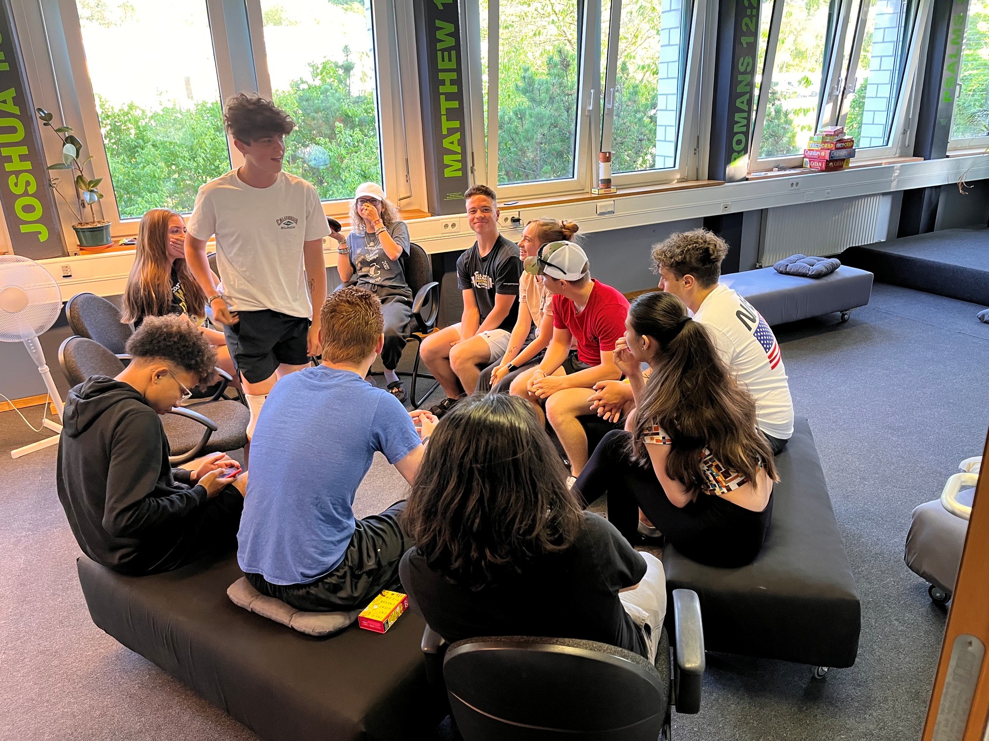 Young people gathered in a circle for conversation