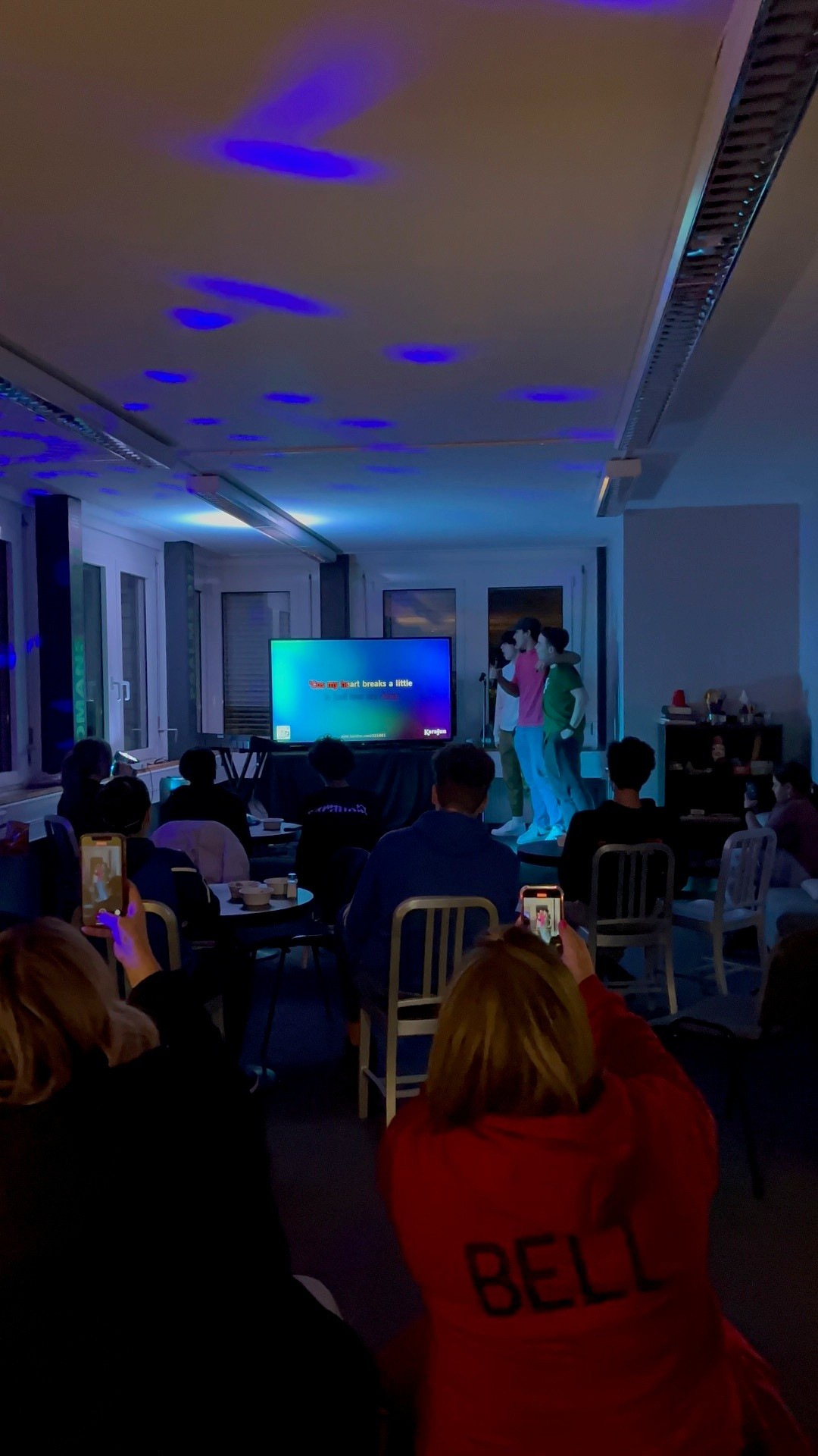 A karaoke performance during a Young and Worthy night